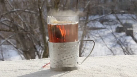 Hot tea outdoors Stock Footage 73006933