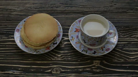 Hot tea with pancakes Stock Footage 63296124