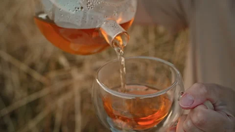 Hot tea is poured into a mug. Close-up. Stock Footage 278902854
