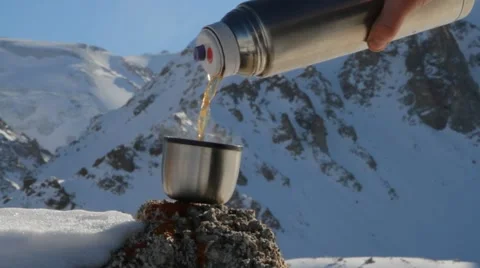 Hot tea poured from a thermos Stock Footage 59742161