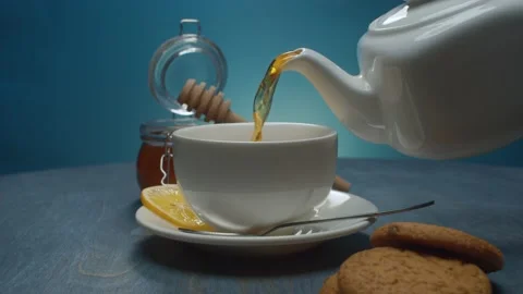 Hot tea pouring into the cup Stock Footage 146272698
