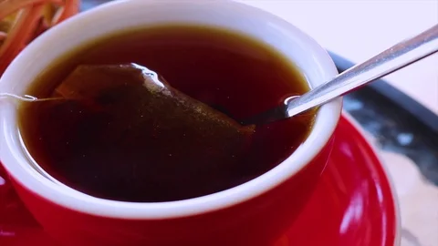 Hot tea in a red cup Stock Footage 98163998