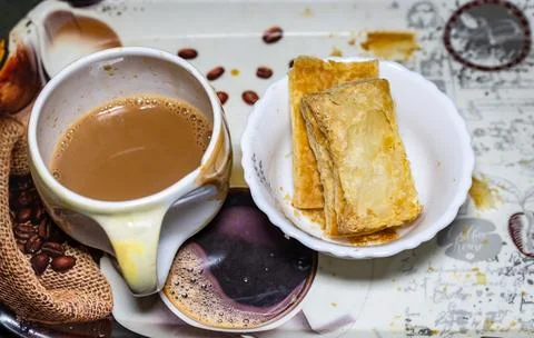 Hot tea served in cup with refreshment close up in details 스톡 사진