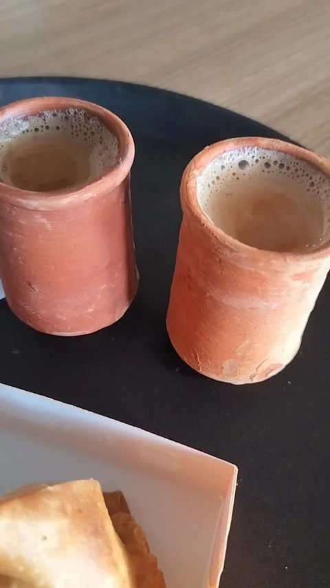 Hot tea served with smoke on a earthenware glass and as a snack. Stock Footage 310006100