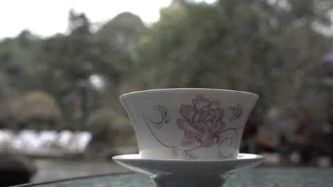 Hot tea is smoking on a table Stock Footage 125342254