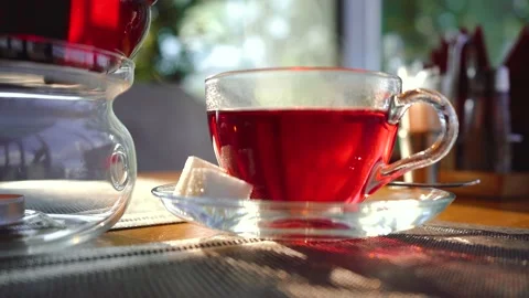 Hot tea is on the table with sugars Stock Footage 149781070