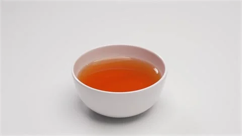 Hot Tea in White Ceramic Bowl on White Background Stock Footage 336706931