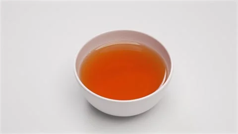 Hot Tea in White Ceramic Bowl on White Background Stock Footage 336706933