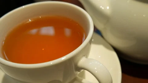 Hot tea in a white cup 库存影片 108252793