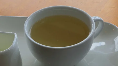 Hot tea on white cups. Stock Footage 80470686