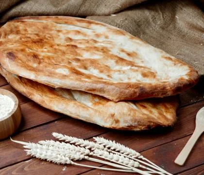 Hot tendir bread on the table _ Stock Photos