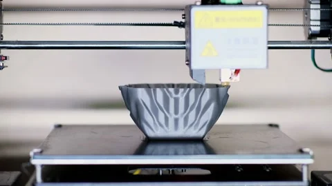 Hot tip of 3d printer makes elegant container in workshop 動画素材 140656075
