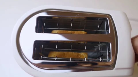Hot toaster. Top view of an electric appliance for frying bread. Close-up of hea Stock Footage 248596533