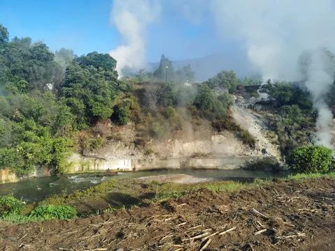 Hot volcanic steam over river in furnas Stock Photos
