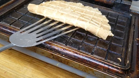 Hot waffles in a waffle maker Stock Footage 124473207