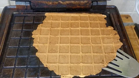 Hot waffles in a waffle maker Video stock 124473236