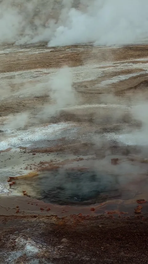 Hot water bubbles inside a geyser hole in the Atacama Desert. Stock Footage 345763444
