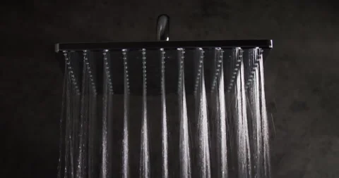Hot water fall down from the watering can of a modern shower system Stock Footage 251535663
