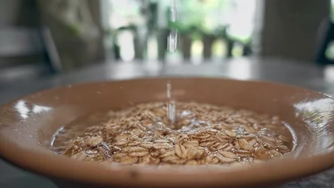 Hot water falling in plate Stock Footage 248529515