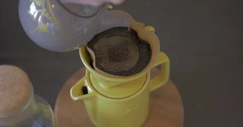 Hot water filtering through delicious ground coffee. Stock Footage 76238002