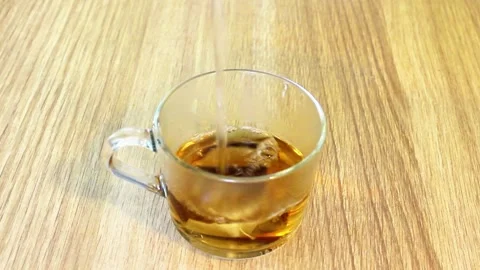 Hot Water Poured into Mug with Tea Bag in Morning Kitchen Stock-Footage 321369547
