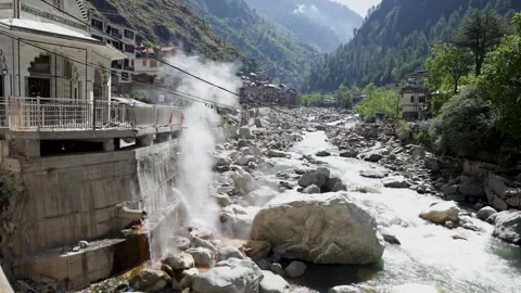 Hot Water Spring Flowing Into a Rocky River in Manikaran Valley India Stock Footage 345368600
