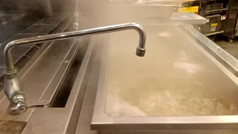 Hot water used to soak noodles before serving to customers. Stock Footage