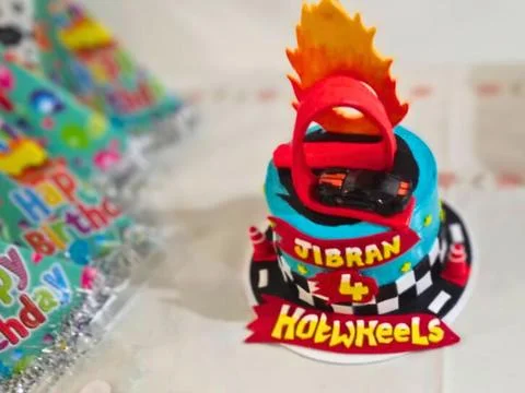 Hot Wheels theme of Cake for 4 year nephew birthday celebration Stock Photos