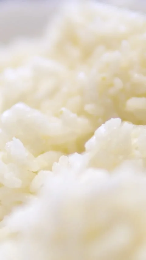 Hot white cooked rice steam bowl kitchen background static. Sticky rice after Stock Footage 302071936