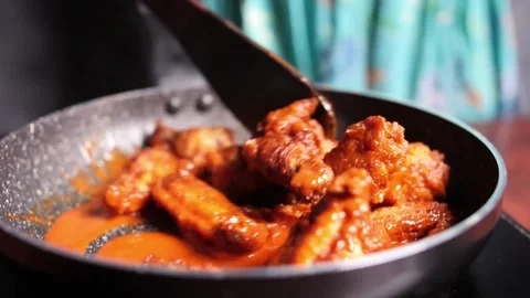 Hot Wings Stirring Stock Footage 135031325