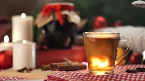 Hot winter tea in a white mug with christmas with slow motion Stock Footage 56557780