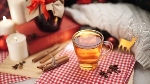 Hot winter tea in a white mug with christmas Stock Footage 56564101