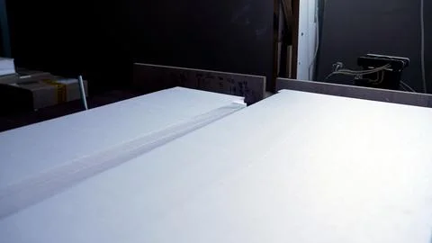 Hot wire cutting through polystyrene foam Stock Photos