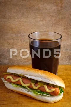 Hotdog and cola Stock Photos