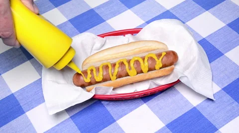 Hotdog with mustard Stock Footage