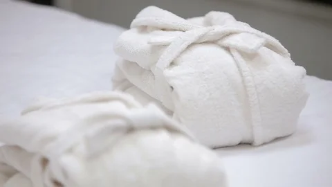 Hotel bathrobes on the bed Video stock 73750713