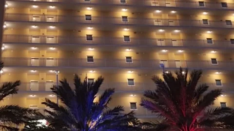 Hotel On The Beach At Dusk Stock Footage 224709406