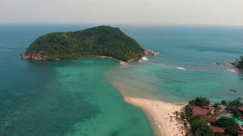 Hotel on beachside. Fly forward. Aerial View Of Paradise Island Stock Footage 236163731