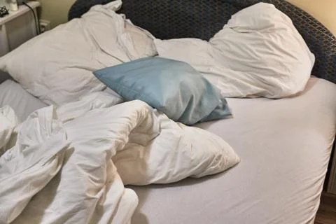 Hotel bed closeup Stock Photos