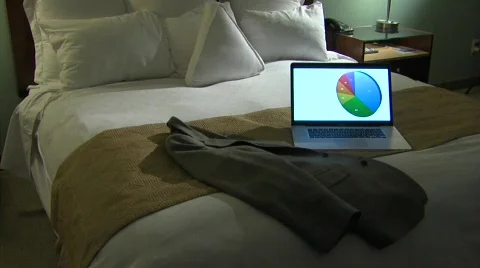 Hotel Bed Computer Tilt up 2 Stock Footage 436321