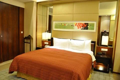 Hotel bed Stock Photos