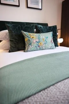 Hotel, bedroom and interior patterns of home decor for accommodation with duvet Stock Photos