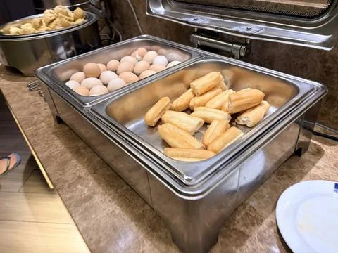 Hotel Breakfast Buffet with Boiled Eggs and Fried Dough Sticks Foto stock