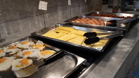 Hotel Breakfast Buffet with Fried Eggs Scrambled Eggs and Boiled Eggs Stock Photos