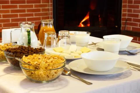 Hotel breakfast near the fireplace comfort Stock-Fotos