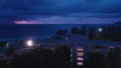 Hotel Building by Deep Blue Ocean Under Pink Twilight Sky Stock Footage 337534073