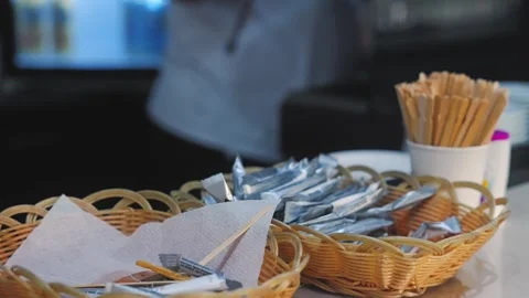 Hotel cafeteria catering setup featuring wicker food baskets, disposable Stock Footage 346916662