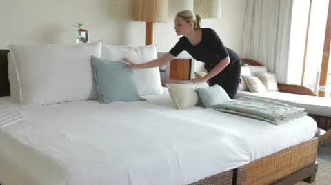 Hotel Chambermaid Making Guest Bed Stock Footage