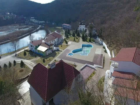 The hotel complex among the mountains and forests Stock Footage 72651313