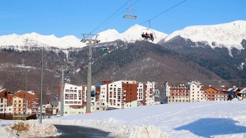 Hotel complex and ski lifts on a sunny day Stockbeeldmateriaal 84735006